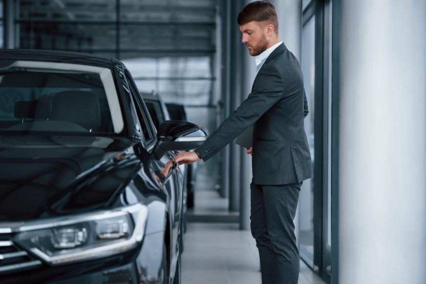 opening-door-modern-stylish-bearded-businessman-automobile-saloon-870x580.jpg